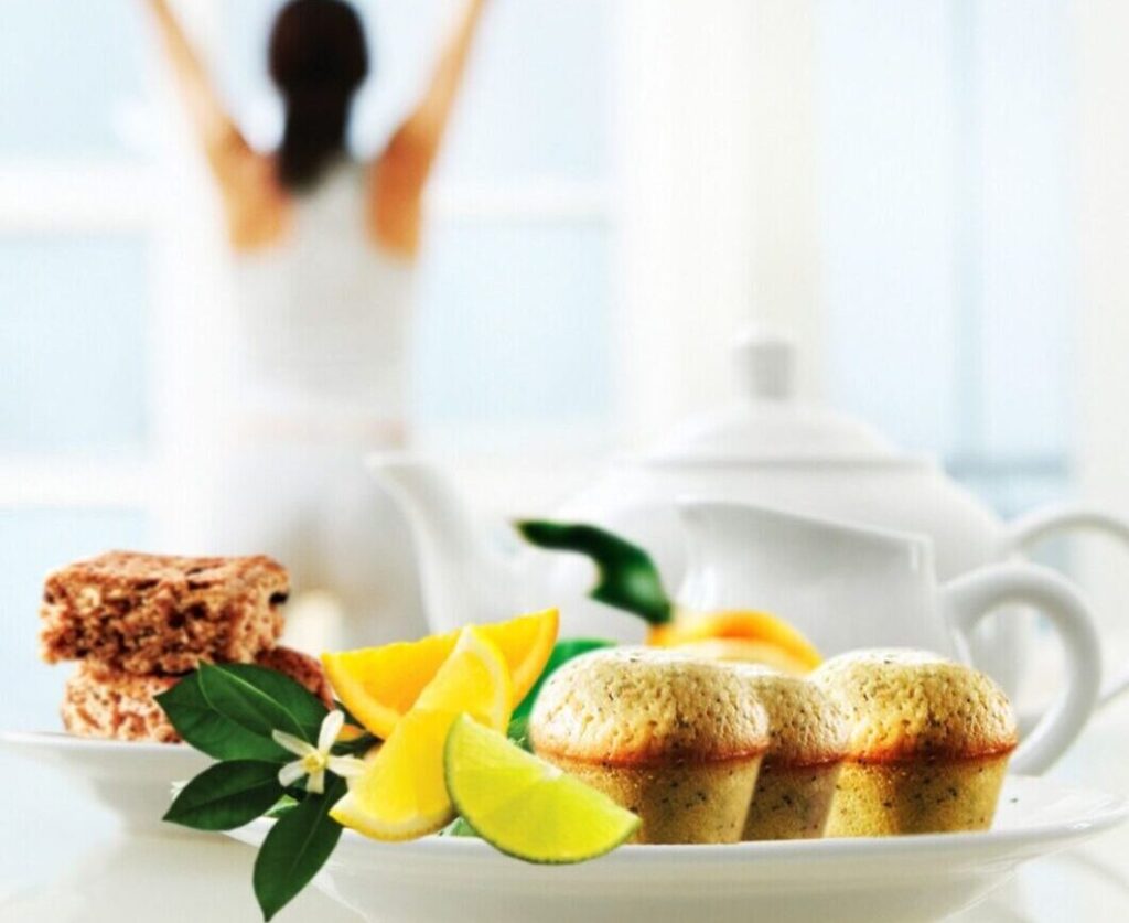 A plate of freshly baked lemon poppy seed mini muffins, perfect for Mother's Day brunch