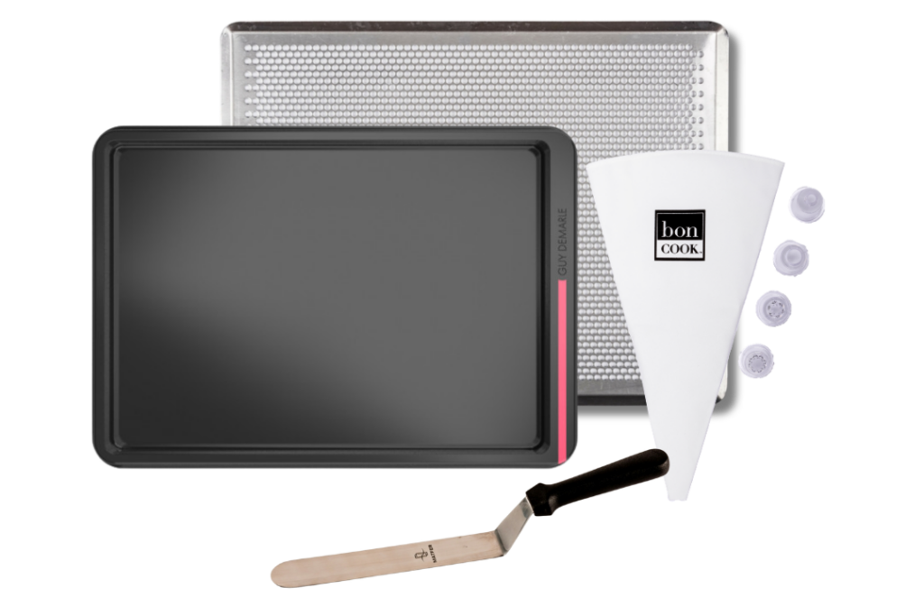 bon COOK Celebration Cake with rectangular tray, perforated baking sheet, pastry bag and tips, and offset spatula.